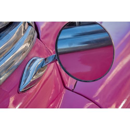 Close-up side mirror on hot pink classic American Oldsmobile in Vieja-old Habana-Havana-Cuba